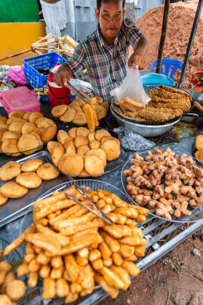 istock Cambodian man selling snacks, Cambodia 1957406076