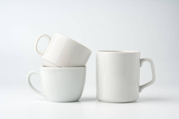 istock Blank white mugs mock up on white background 1957406671