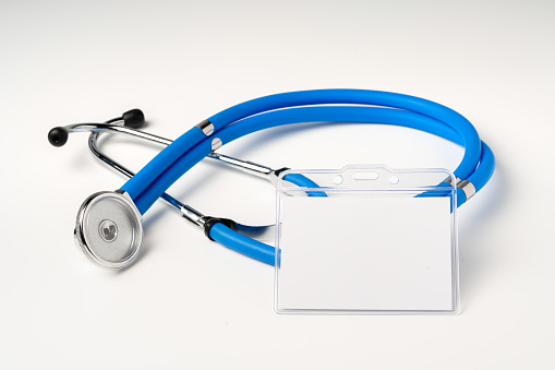 Blank badge and stethoscope on white background copy space