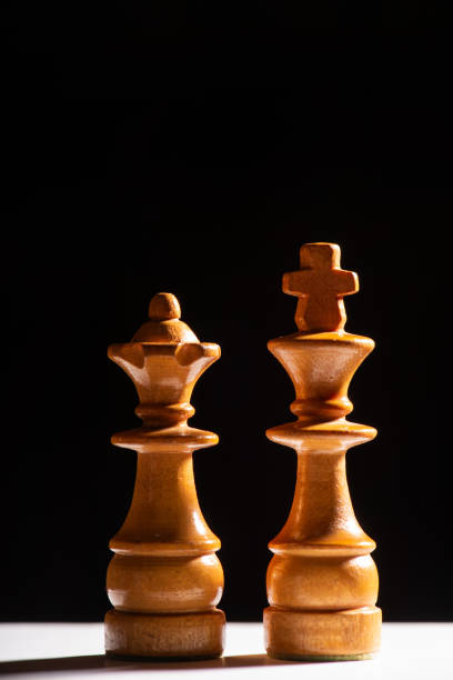 istock Chess pieces,beautiful old chess pieces on a board, black background, selective focus. 1957407757