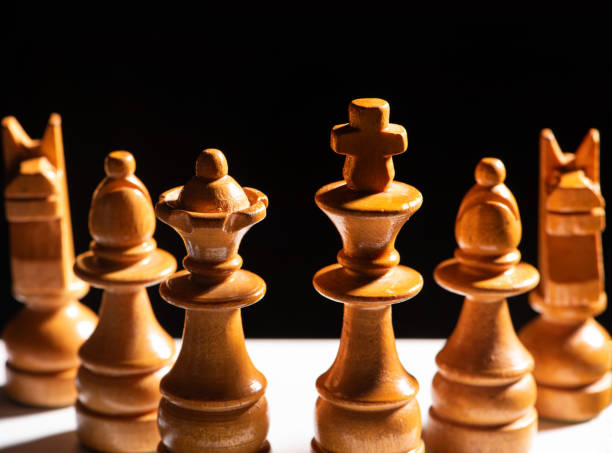 istock Chess pieces,beautiful old chess pieces on a board, black background, selective focus. 1957407771