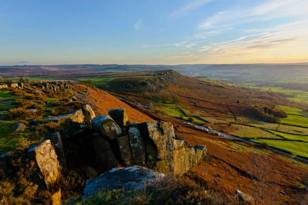 istock Hazy late winter afternoon sun across Curbar Edge and Baslow Edge. 1957415094