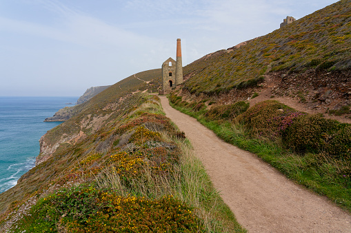 The derelict Wheal Coates tin mine clings to a cliff side between Porthtowan and St Agnes in Cornwall.