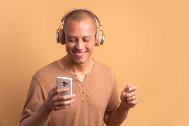 istock excited man dancing with headphones 1957417403