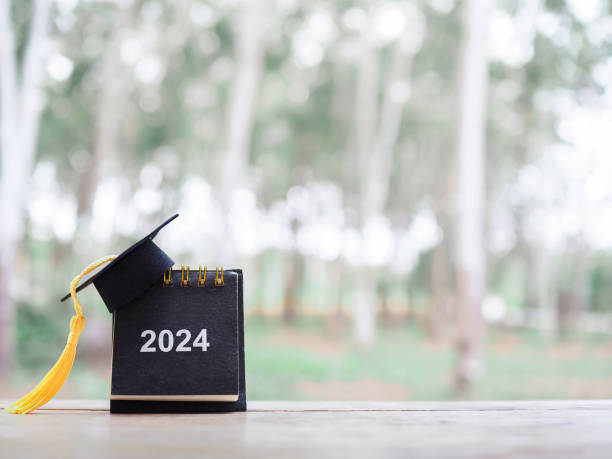 istock Study goals, 2024 Desk calendar with graduation hat. The concept for Resolution, Goal, Action, Planning, and manage time to success graduate. 1957427962