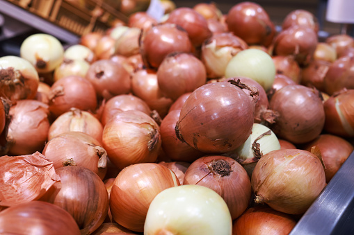 fresh onion selling in supper market, vegetable, and food concept.Ripe bulb onions Close-up Background Or Texture. Bulb onions Harvest, Many Bulb onions
