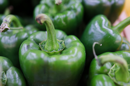 Green bell peppers, Close-up giant green chili selling in supermarket, vegetable and food concept,green capsicum or green bell pepper in supermarket.