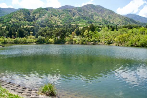 istock Pond and mountain scenery in Komagane City 1957454276