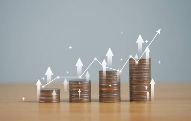 istock stack of silver coins with trading chart in financial concepts and financial investment business stock growth, for financial banking increase interest rate. 1957454792