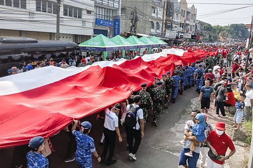 Hundreds of citizens took part in the Red and White Carnival in Bogor City, West Java, Sunday 13 August 2023. A 100 meter long red and white flag was paraded as part of the Red and White Carnival to welcome the 78th independence day of the Republic of Indonesia