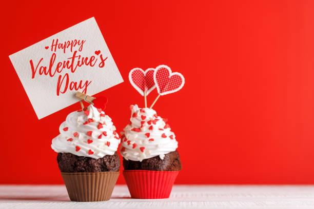 istock Cupcake love: Heart-themed treats on a vibrant red backdrop 1957484437