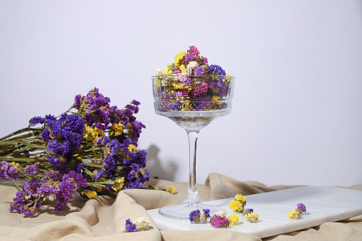 spring. flowers of different colors in a transparent glass