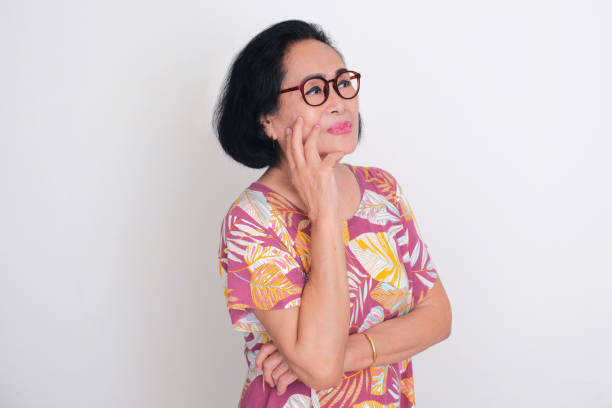 istock Elderly Asian woman looking away when contemplating 1957491404