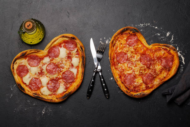 istock Heart-shaped pizzas: Delicious love-themed dish 1957491414