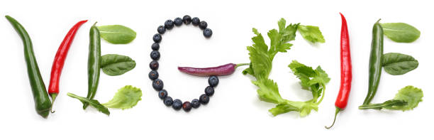 letters V E G G I E from red, green, purple, yellow chili pepper, blueberries, salad lettuce leaf letters