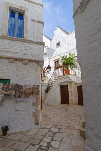 View of whitewashed street in the old town of Locorotondo, Itria Valley, Apulia region, Italy
