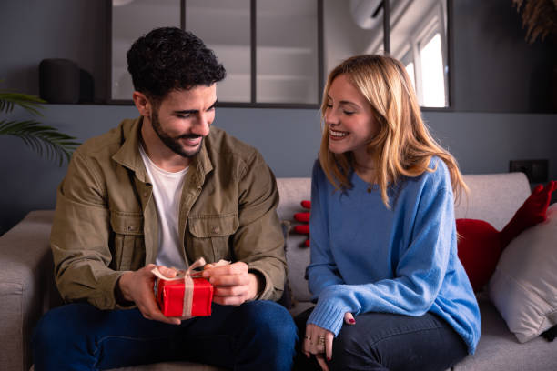 istock Valentine's Day celebration, gift giving and romantic couple concept. 1957541841