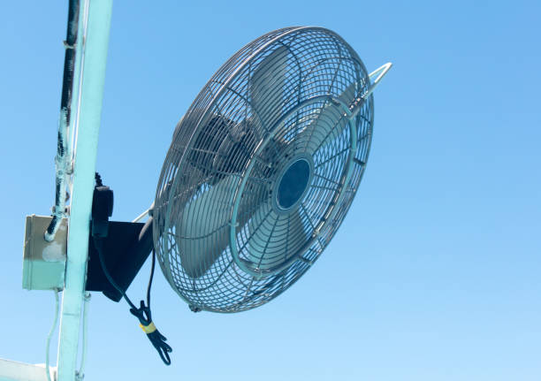 istock Fan with humidifier against blue sky 1957556115