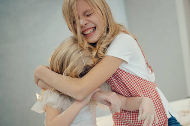 children playing with flour in the kitchen