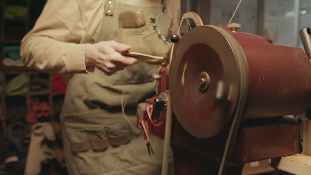 Shoemaker Working with Stitching Machine