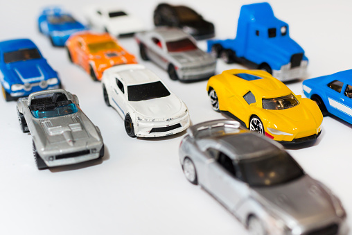The group of miniature car toy on the road. Traffic jam concept with multiple toy cars on a white background.pollution.global warming,co2 concept.
