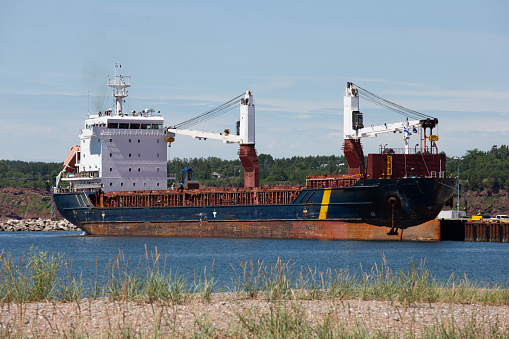 This aerial drone photo shows a large ship sailing on the river Thames in England.