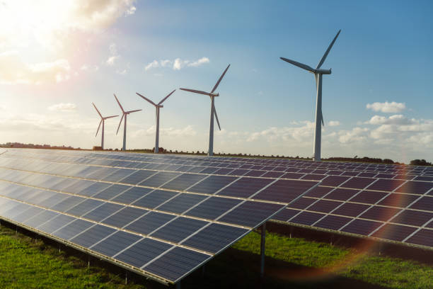 istock Wind turbine and solar panels energy generators on wind farm 1957591659