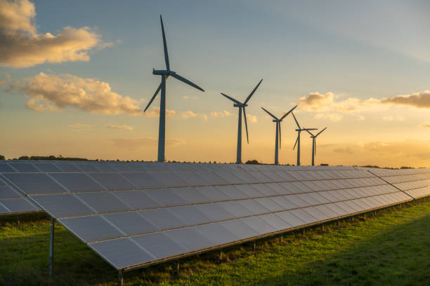 istock Wind turbine and solar panels energy generators on wind farm 1957591674