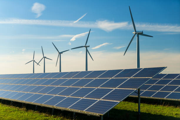 Wind turbine and solar panels energy generators on wind farm, United Kingdom