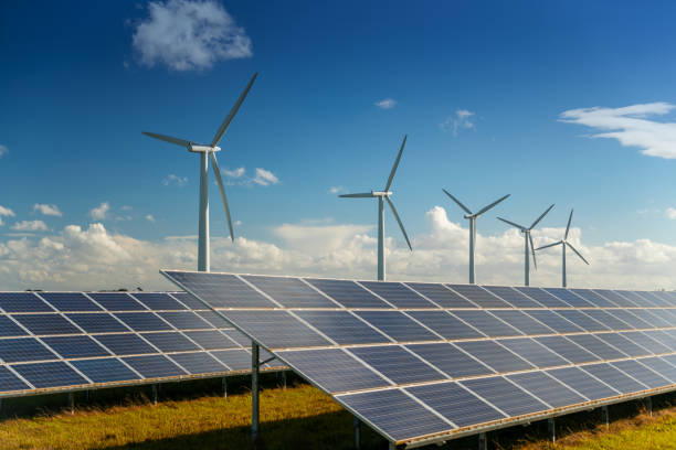 istock Wind turbine and solar panels energy generators on wind farm 1957593349