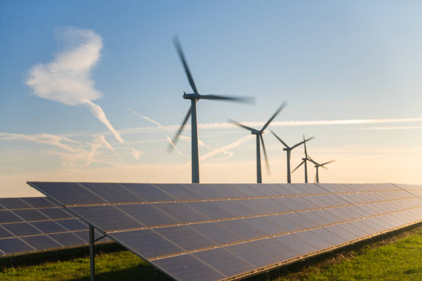istock Wind turbine and solar panels energy generators on wind farm 1957593351