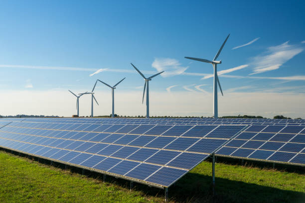 istock Wind turbine and solar panels energy generators on wind farm 1957600924