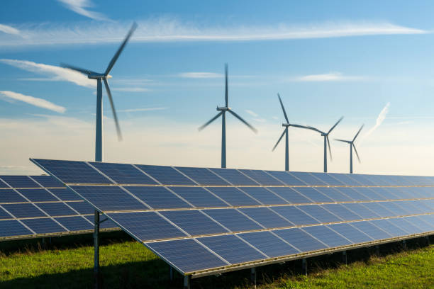 istock Wind turbine and solar panels energy generators on wind farm 1957601463