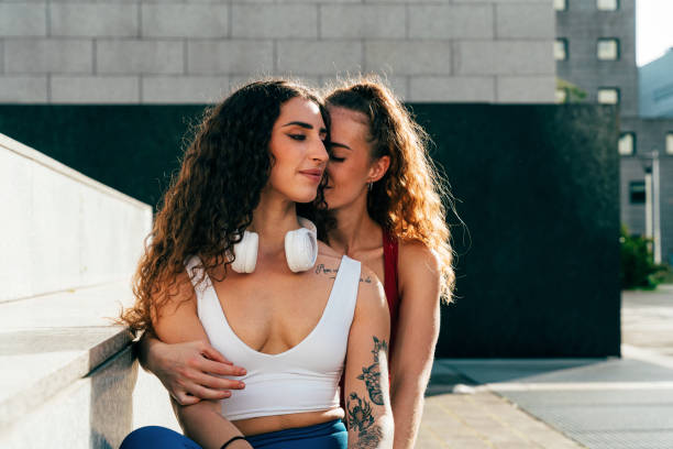 Lgbt couple training together outdoor. Runner real couple making sport in an urban area of the city. Concepts of sports and lifestyle