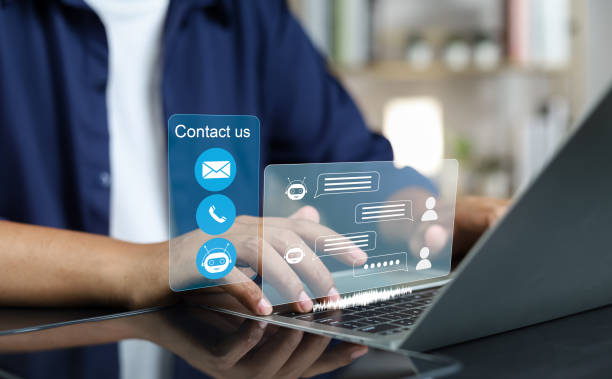 istock Businessman using AI chatbot conversation assistant in app on device for virtual assistance and customer support digital communication, Contact us Online service with AI Chatbot for efficient support. 1957651034