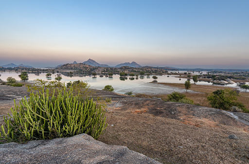 Vibrant sunrise over the dramatic boulder covered landscape in the Jawai region of Rajasthan, India Asia.