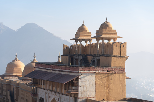 A side view of the Bibi Ka Maqbara tomb against a clear blue sky in Aurangabad, Maharashtra, India