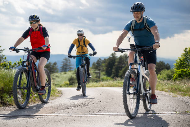 istock Group Of Cyclists Riding Electric Mountain Bikes 1957723866