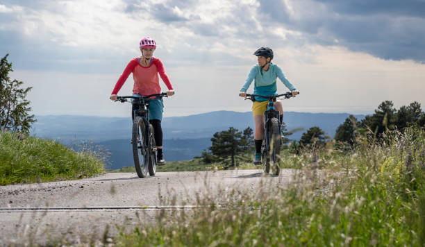 istock Two Women Riding Electric Mountain Bikes 1957723870