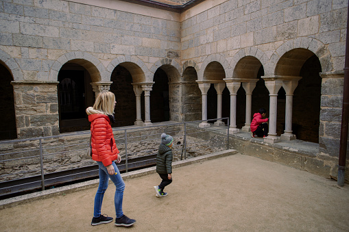 Pere de Roda, Girona, Spain; December 28, 2023; Tourists visiting the monastery