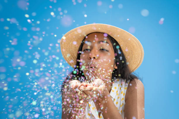 istock Woman blowing glitter from palms 1957746599