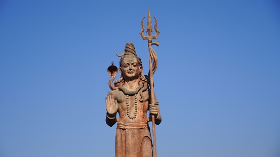statue of god shiv holding trishul