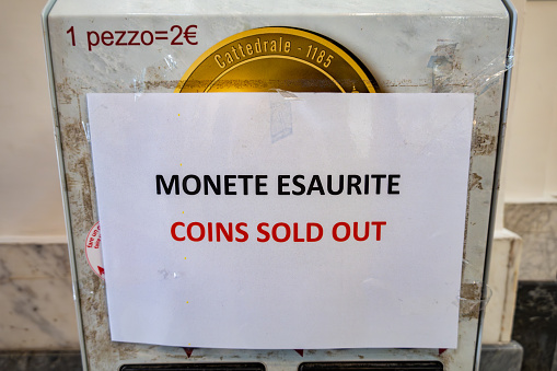 Palermo, Sicily, Italy Jan 14, 2024 A coin press machine says in Italian and English that coins are sold out.