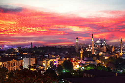 Sunset view over Hagia Sophia and the Bosphorus Bridge of Istanbul, view on the city skyline, Turkey.