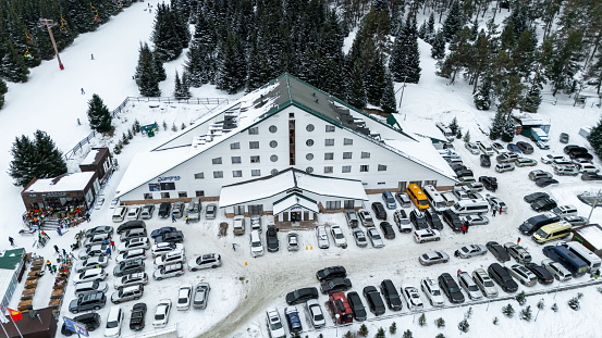 Karakol, Kyrgyzstan - January 21, 2024: Aerial view of Kapriz Karakol Hotel building in skiing resort