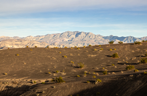 Landscape of the Ubehebe volcanic field under a vast desert sky, in California's Death Valley National Park