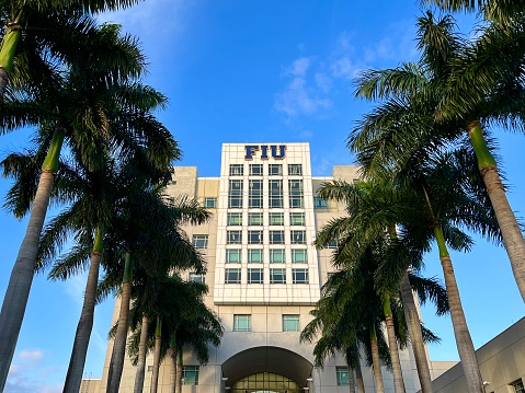 Miami, Florida, USA - January 23, 2024: Principal facade of Florida International University FIU in Miami, Florida. \n\nFIU is the largest university in South Florida, the second-largest in Florida, and the fourth-largest in the United States by enrollment. FIU is classified as a research university with highest research activity.