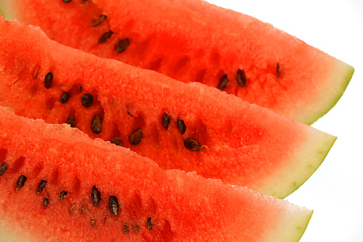 sliced fresh seed watermelon isolated on white background