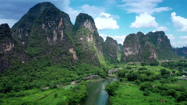 Aerial footage of beautiful mountain and river natural scenery in Guilin at sunrise, China.  Lijiang River Scenic Area is a famous tourist attraction in Guilin.