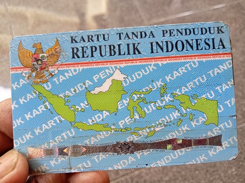 Photo of Indonesian identity card in hand